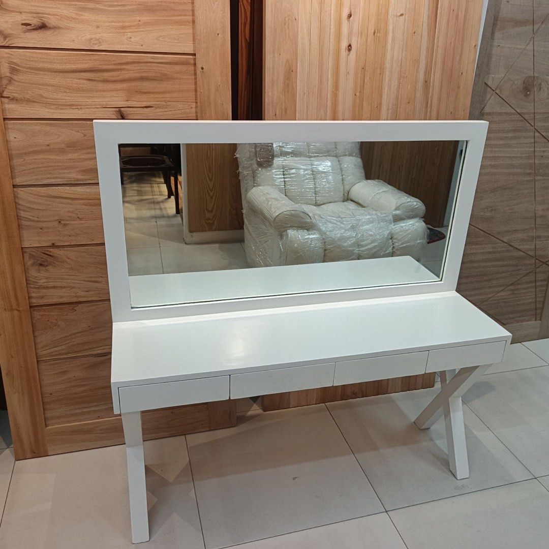 Kids White Dressing Table with Mirror and Drawers (Category: Tables & Sets) located in Pasig City. Submitted by bernamascarinas (Listing ID 1453948357, Image 2). Description: - Chic white dressing table for kids - Large mirror for a clear view - Three spacious drawers for storage - Unique criss-cross leg design - Ideal for bedrooms or vanity areas - Dimensions: 120cm (Width) x 35cm (Depth) x 123cm (Height).