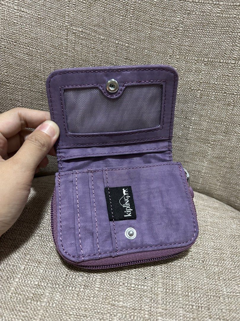 Kipling Bifold Wallet - Original (PAMIGAY PRICE) (Category: Wallets & Card holders) located in Quezon City. Submitted by ladyJR (Listing ID 1453819414, Image 3). Description: Super Bagsak presyo for an original bag - Personal bag ALL ORIGINAL!! Rfs: Decluttering, need space and funds FREE crochet hair tie/clip!! Kipling Bifold Wallet - Original Used Once - No Issue Bought from US Live Seller Size: M - cm, W - cm, H - cm Actual color: Light Purple