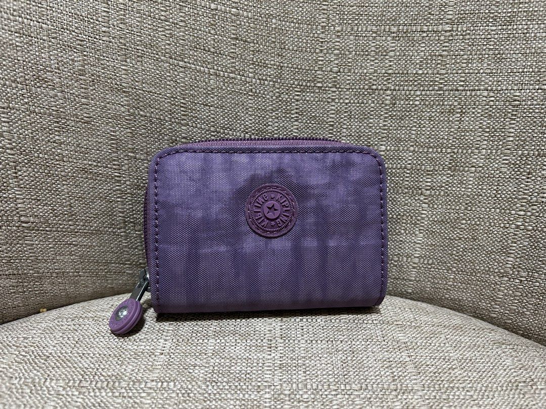Kipling Bifold Wallet - Original (PAMIGAY PRICE) (Category: Wallets & Card holders) located in Quezon City. Submitted by ladyJR (Listing ID 1453819414, Image 1). Description: Super Bagsak presyo for an original bag - Personal bag ALL ORIGINAL!! Rfs: Decluttering, need space and funds FREE crochet hair tie/clip!! Kipling Bifold Wallet - Original Used Once - No Issue Bought from US Live Seller Size: M - cm, W - cm, H - cm Actual color: Light Purple