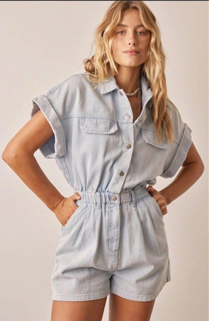 Light Wash Denim Short Sleeve Romper (Category: Rompers) located in Manila. Submitted by decluterthings888 (Listing ID 1453997994, Image 1). Description: - Cute light wash denim romper. NO BRAND - Short sleeves with rolled cuffs - Elasticated waist for comfort - Button-up front - Functional pockets - Ideal for casual outings - Versatile styling with sneakers or sandals.