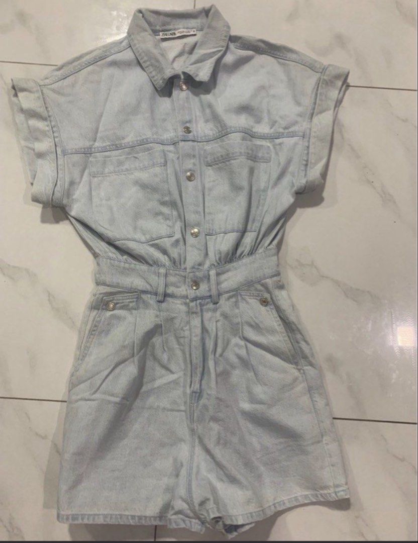 Light Wash Denim Short Sleeve Romper (Category: Rompers) located in Manila. Submitted by decluterthings888 (Listing ID 1453997994, Image 2). Description: - Cute light wash denim romper. NO BRAND - Short sleeves with rolled cuffs - Elasticated waist for comfort - Button-up front - Functional pockets - Ideal for casual outings - Versatile styling with sneakers or sandals.
