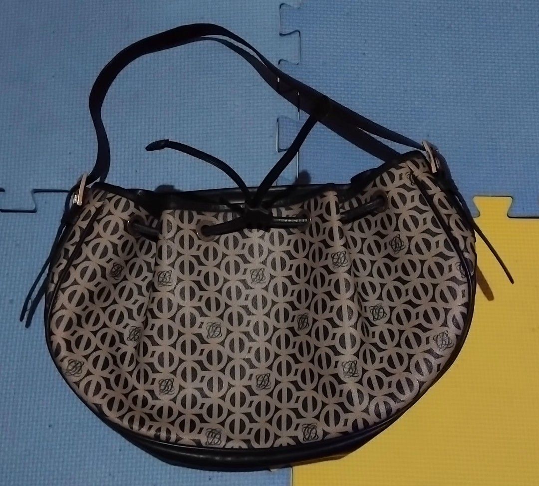 Louis Quatorze Monogram Shoulder Bag (Category: Shoulder Bags) located in Tarlac. Submitted by lollylally (Listing ID 1453840803, Image 1). Description: Louis Quatorze monogram shoulder bag. Black/beige with drawstring closure and adjustable strap. Interior zip pocket. Good capacity for daily use. with flaws check the photos .