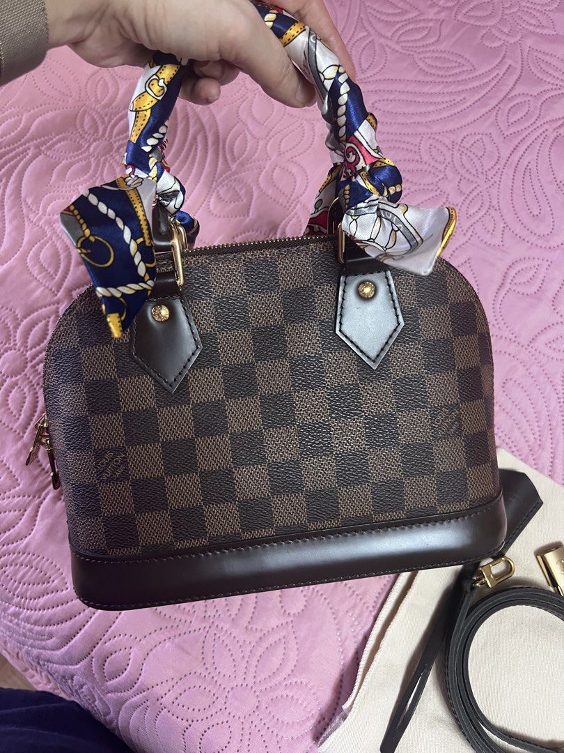 Louis Vuitton Monogram Alma BB Microchipped (Category: Luxury Bags & Wallets) located in Naga. Submitted by christinescollections (Listing ID 1453853914, Image 2). Description: - Authentic Louis Vuitton Alma BB - Classic Monogram Canvas - Includes detachable shoulder strap - Comes complete except receipt. with unused padlock clochet keys & long strap, box, dustbag - Gold hardware - Made in France - Microchipped.