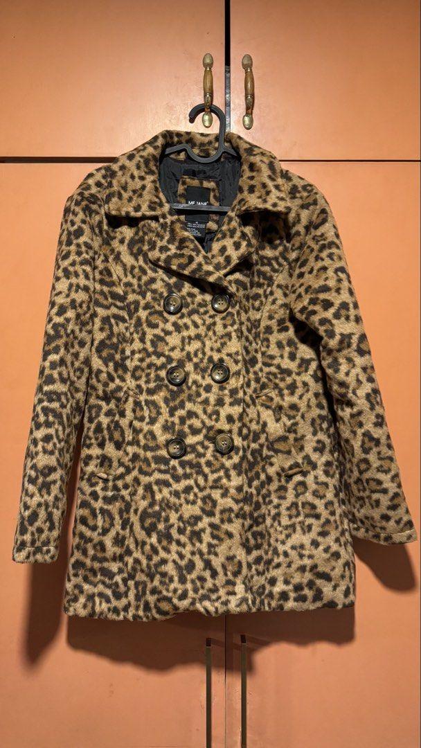 Leopard Print Coat Jacket (Category: Coats, Jackets and Outerwear) located in Quezon City. Submitted by baddiez_closett101 (Listing ID 1453944334, Image 3). Description: Description: Make a bold statement with this cozy and chic leopard print double-breasted pea coat by Me Jane. Designed with a soft, faux-fur/fleece finish, dark tortoise-shell buttons, side slit pockets, and a decorative buttoned back waist strap, this coat adds instant edge and 