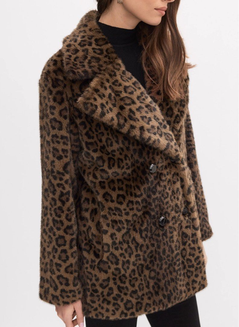 Leopard Print Coat Jacket (Category: Coats, Jackets and Outerwear) located in Quezon City. Submitted by baddiez_closett101 (Listing ID 1453944334, Image 2). Description: Description: Make a bold statement with this cozy and chic leopard print double-breasted pea coat by Me Jane. Designed with a soft, faux-fur/fleece finish, dark tortoise-shell buttons, side slit pockets, and a decorative buttoned back waist strap, this coat adds instant edge and 