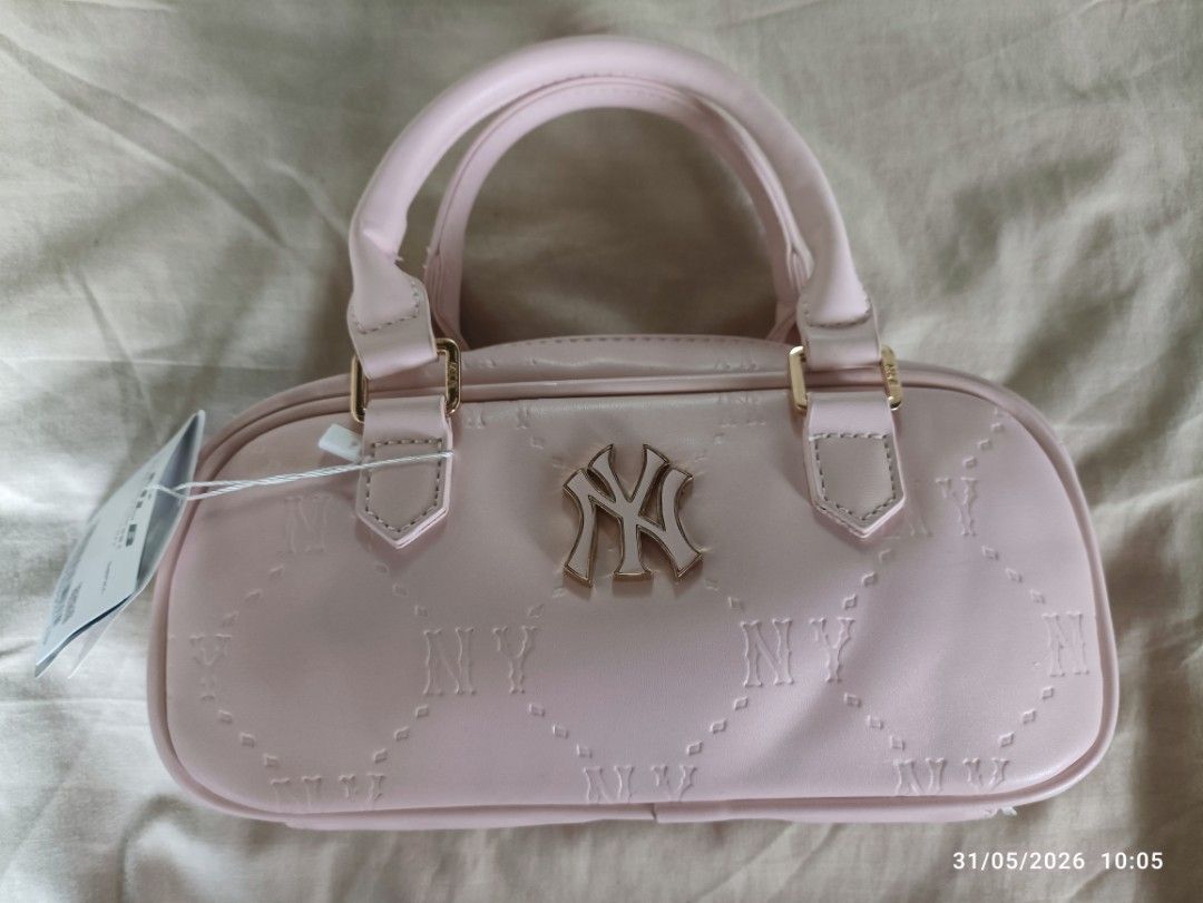 MLB Pink Monogram Mini Boston Bag (Category: Luxury Bags & Wallets) located in Caloocan City. Submitted by calm.gentle.carleenballes (Listing ID 1454001075, Image 1). Description: - Adorable pink MLB mini Boston bag - Features iconic NY logo - All-over monogram pattern for a stylish look - Elegant gold hardware details - Includes a detachable strap for versatile wear - Compact size, ideal for carrying your essentials - Great for daily use or as a