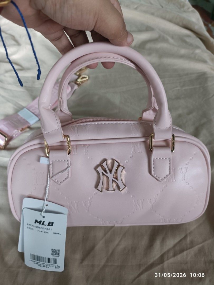 MLB Pink Monogram Mini Boston Bag (Category: Luxury Bags & Wallets) located in Caloocan City. Submitted by calm.gentle.carleenballes (Listing ID 1454001075, Image 2). Description: - Adorable pink MLB mini Boston bag - Features iconic NY logo - All-over monogram pattern for a stylish look - Elegant gold hardware details - Includes a detachable strap for versatile wear - Compact size, ideal for carrying your essentials - Great for daily use or as a