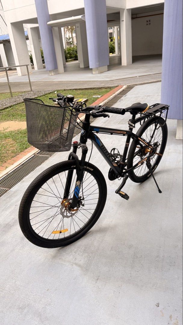 MTB cycle (Category: Bicycles) located in Singapore. Submitted by madiwalarp (Listing ID 1453919985, Image 3). Description: - Sturdy MTB cycle - Features a front basket for convenience - Includes a rear rack for carrying items - Equipped with CST All Terrain tires for reliable grip.