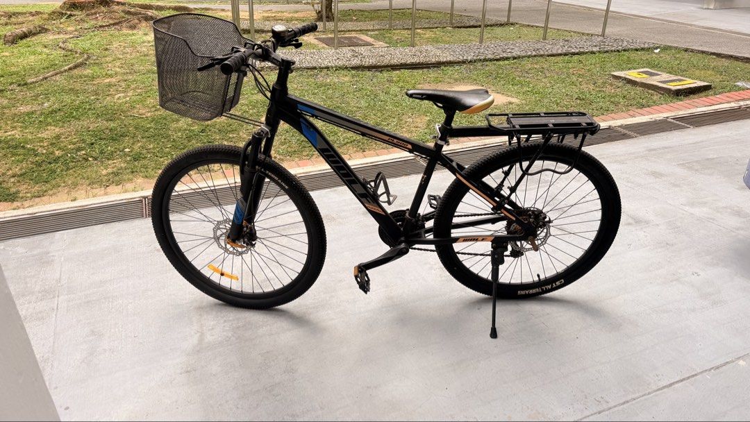 MTB cycle (Category: Bicycles) located in Singapore. Submitted by madiwalarp (Listing ID 1453919985, Image 2). Description: - Sturdy MTB cycle - Features a front basket for convenience - Includes a rear rack for carrying items - Equipped with CST All Terrain tires for reliable grip.