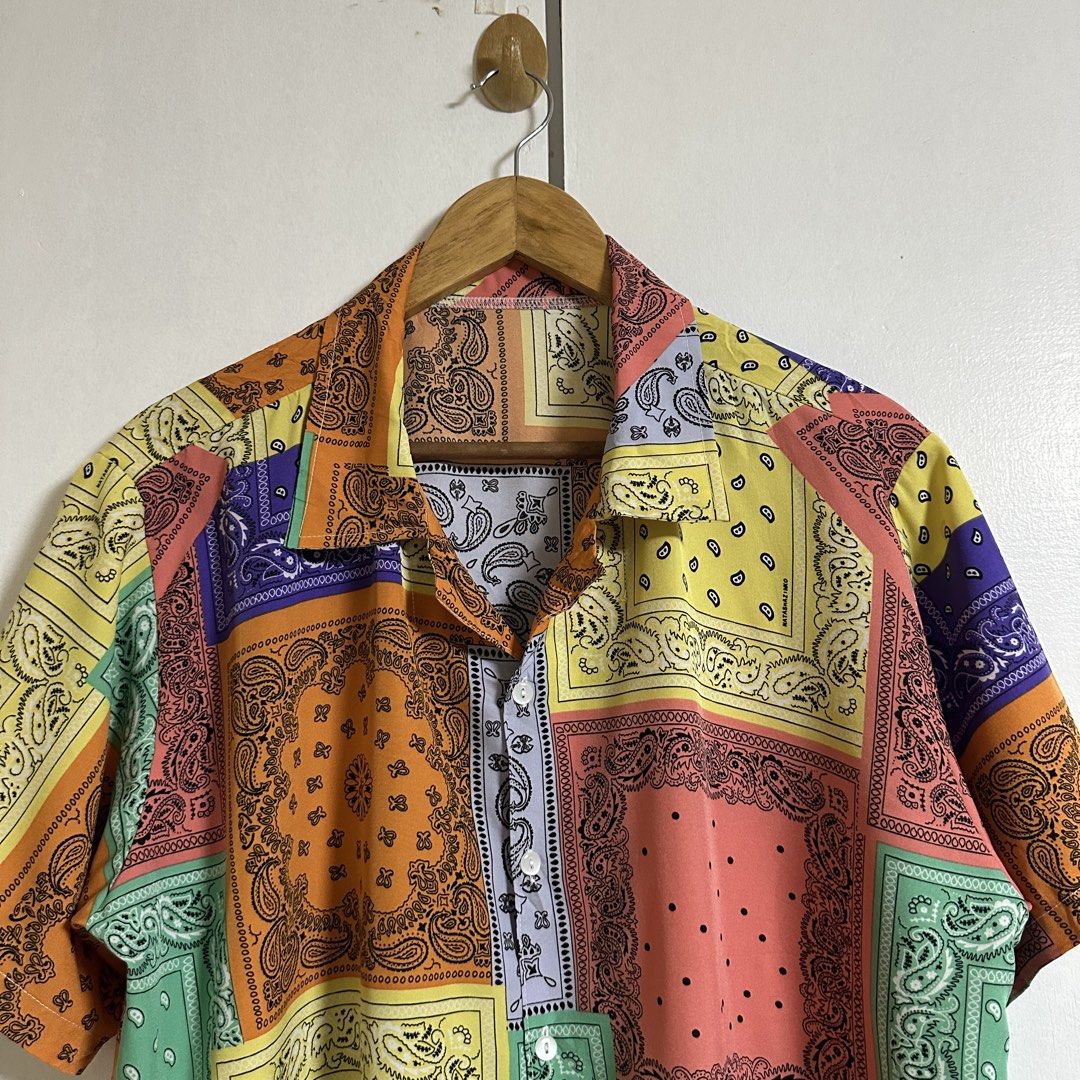 Multi-color Bandana Patchwork Short sleeves Polo (Category: Formal Shirts) located in General Trias. Submitted by seconddegreeco (Listing ID 1453950889, Image 2). Description: Multi-color Bandana Patchwork Short sleeves Polo Large 29 length 25 width Like new ✨ No issue.