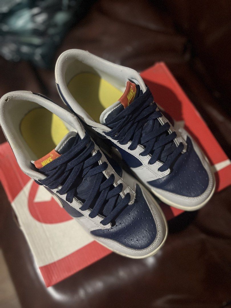 Nike Dunk Low BG (Category: Babies & Kids Fashion) located in Quezon City. Submitted by assdeclutters (Listing ID 1453897659, Image 2). Description: - Colorway: Photon Dust/White - Unique graphic detail on the side (Nike logo turns yellow when sunlight strikes) - Comes with original box Size 6Y, can be worn by adults US 7 women (24 cm). Rfs: decluttering, size is a bit smaller than what I expected. Price is negotiable!!.