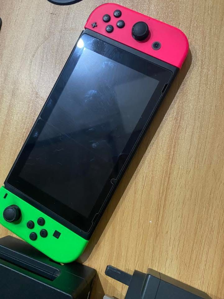 Nintendo Switch Console v1 (Category: Nintendo) located in Quezon City. Submitted by kitsukemen (Listing ID 1454002557, Image 1). Description: - Nintendo Switch Console - Neon Pink and Green (FULL DISCLOSURE HAS DRIFT PROBLEMS) - Dock is exposed For sale: Nintendo Switch V1. - The tablet/unit itself is working really well and is in great condition. Details: Joy-Cons: Pink & Green (Note: Both have drift). No history of repairs Unit Only: Comes wit