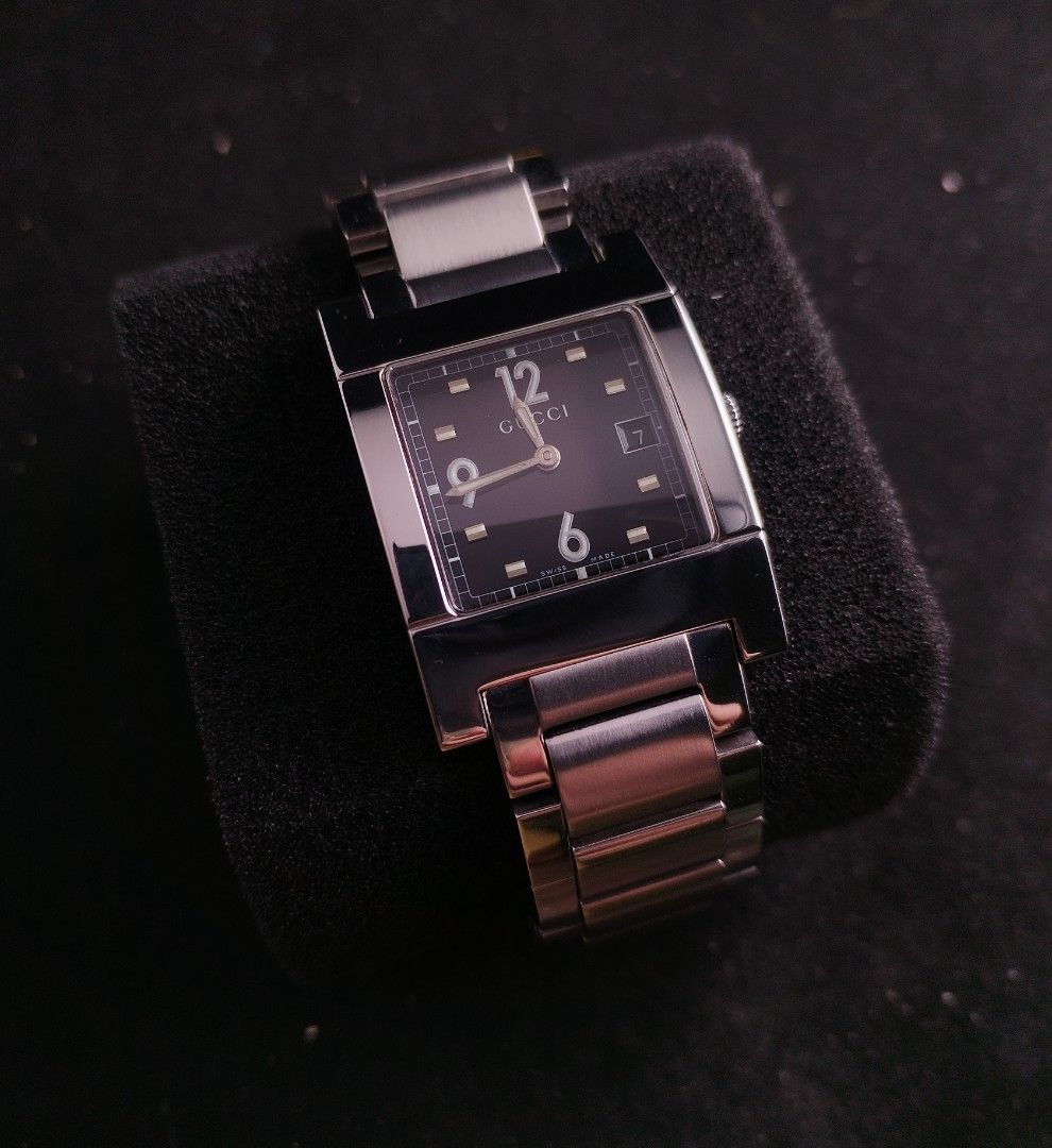 Original Gucci 7700M Swiss watch (Category: Luxury Watches) located in San Juan City. Submitted by exclusivelyours (Listing ID 1453891005, Image 3). Description: A sophisticated Gucci 7700M Swiss Made timepiece featuring an elegant black dial, and integrated stainless-steel bracelet. ▪️ Case: Stainless Steel ▪️ Case Size: Approx (28 × 38 mm) ▪️ Crystal: Sapphire Bracelet: Integrated Stainless Steel Clasp: Deployment/Buckle Functions: Hours, Minut