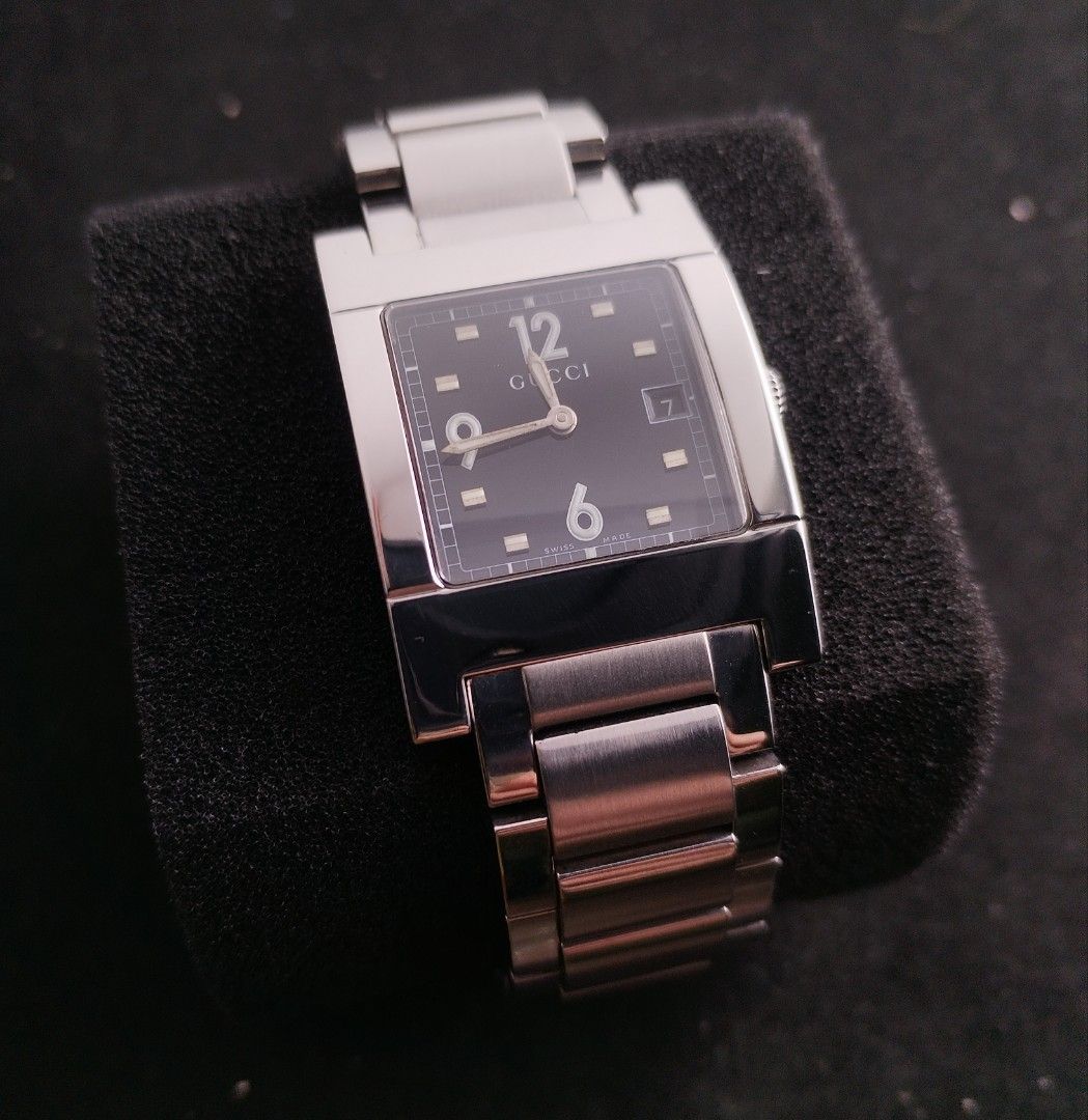 Original Gucci 7700M Swiss watch (Category: Luxury Watches) located in San Juan City. Submitted by exclusivelyours (Listing ID 1453891005, Image 1). Description: A sophisticated Gucci 7700M Swiss Made timepiece featuring an elegant black dial, and integrated stainless-steel bracelet. ▪️ Case: Stainless Steel ▪️ Case Size: Approx (28 × 38 mm) ▪️ Crystal: Sapphire Bracelet: Integrated Stainless Steel Clasp: Deployment/Buckle Functions: Hours, Minut