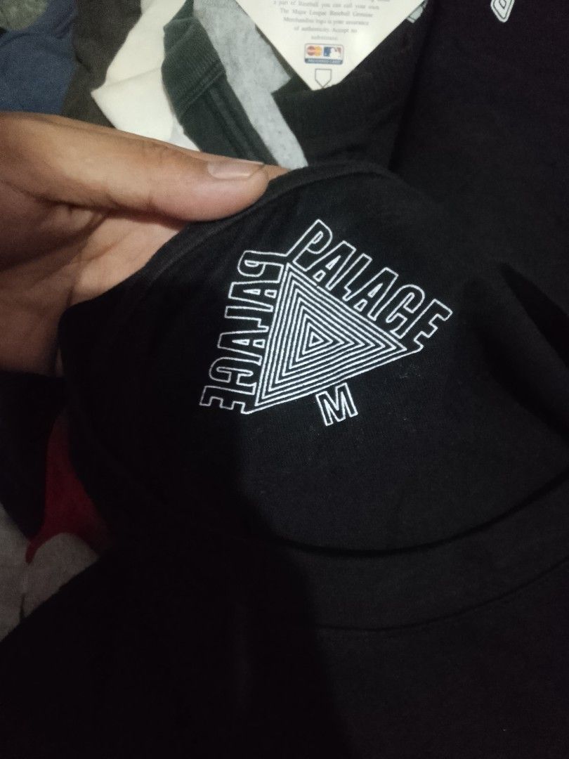 Palace Tri-Ferg Black T-Shirt (Category: Tshirts & Polo Shirts ) located in Quezon City. Submitted by theoneshop1 (Listing ID 1453959053, Image 3). Description: - Brand: Palace - Design: Iconic Tri- Ferg logo on front and back - Detail: Small logo on chest pocket area - Color: Black - Size: Medium (M) - Condition: Great for casual wear. Please check photos for detailed condition. - Authenticity: Genuine Palace item..