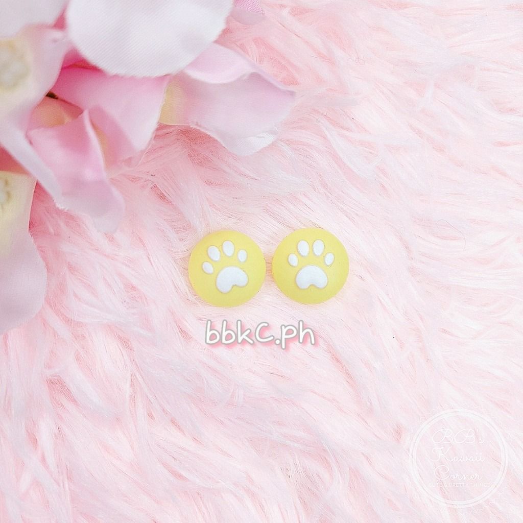 Paw Thumb Grips for Nintendo Switch / Switch Lite - 2pcs Yellow (Category: Controllers) located in Mandaluyong City. Submitted by bbkc.ph (Listing ID 1453631447, Image 1). Description: 🌸 Designed for Nintendo Switch & Switch Lite 🌸 Protects your original analog joysticks from dirt and wear and tear 🌸 May fit 3rd party controllers with small analog joysticks 🌸 Quantity: 2pcs 🌸 Material: Silicone 🌸 This variation has no cardboard packaging 🌸