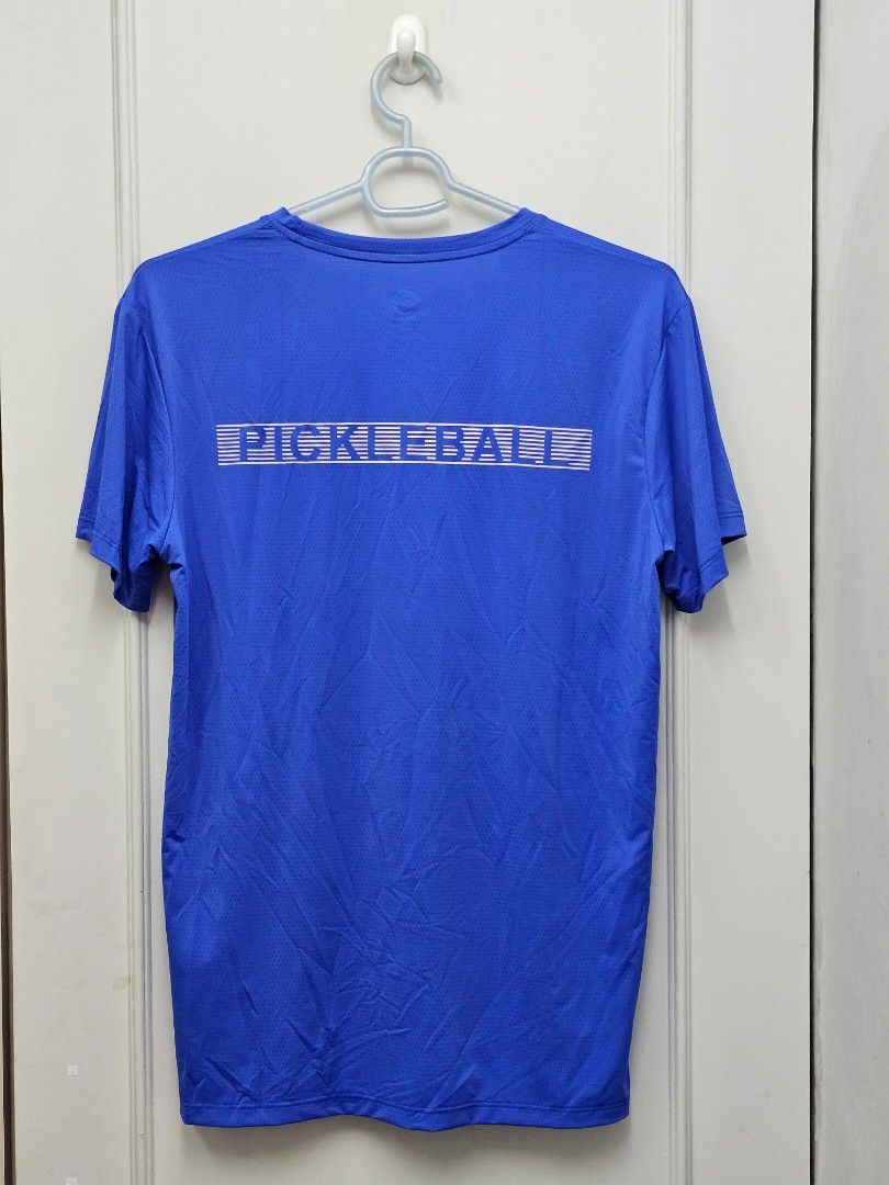 Pickleball Shirt M Blue and Black (Category: Tshirts & Polo Shirts ) located in Las Pinas. Submitted by run88 (Listing ID 1453846516, Image 2). Description: - Blue and Black Protech t-shirt, Size: Medium - Features a graphic on the front and 'PICKLEBALL' text on the back Made with breathable, textured fabric Ideal for playing pickleball or casual wear Spandex DIMENSIONS: L: 29 inches W: 20" Shoulder: 18" Sleeve: 8" Bnew. fitted only. RFS: not my 