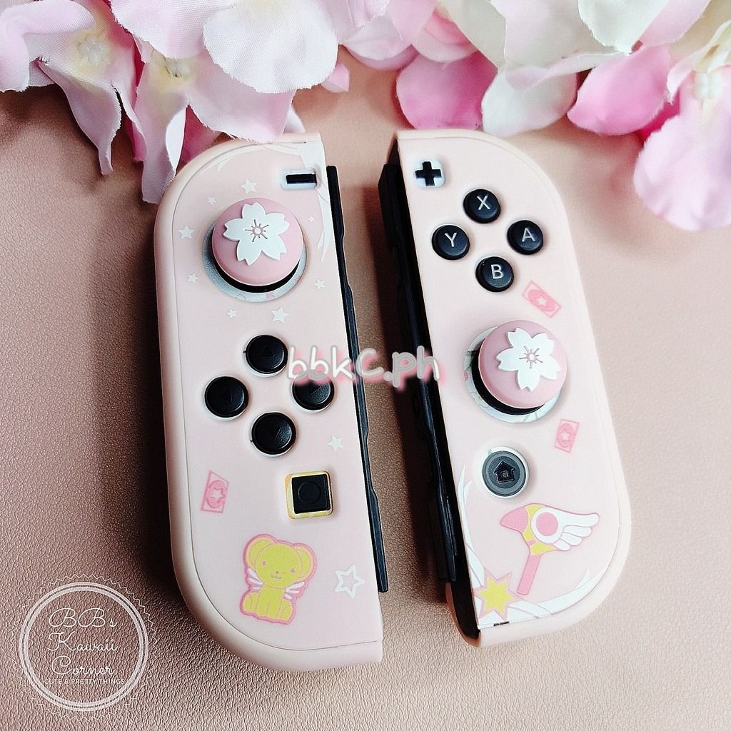 Sakura Thumb Grips for Nintendo Switch / Switch Lite - 2pcs Pink Combo (Category: Controllers) located in Mandaluyong City. Submitted by bbkc.ph (Listing ID 1453630451, Image 1). Description: 🌸 Designed for Nintendo Switch & Switch Lite 🌸 Protects your original analog joysticks from dirt and wear and tear 🌸 May fit 3rd party controllers with small analog joysticks 🌸 Quantity: 2pcs 🌸 Material: Silicone 🌸 This variation has no cardboard packa