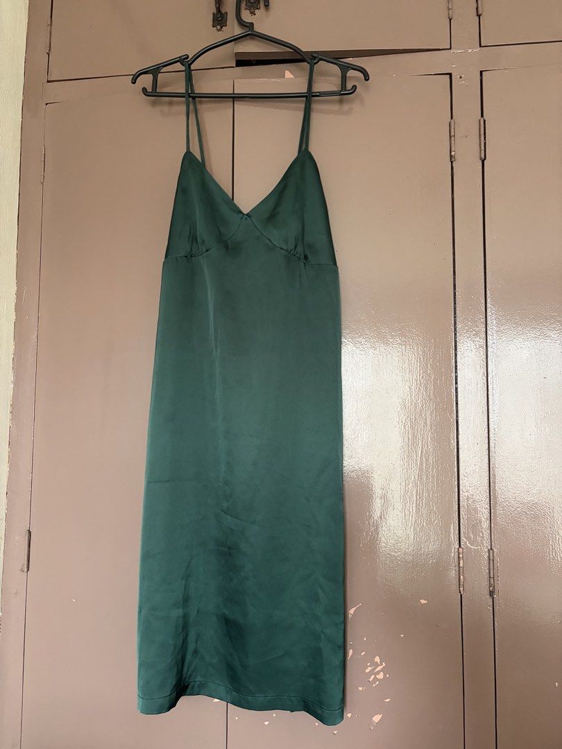 Satin Slip Dress - Dark Green (Category: Dresses) located in Quezon City. Submitted by crystalivory (Listing ID 1453843674, Image 2). Description: - XS to M - Elegant dark green satin slip dress - Features a flattering V-neckline and delicate spaghetti straps - Midi length for a sophisticated look - Please note: small snag on the front and another on the back near the strap (shown in photos) - Otherwise in good, pre-loved condition.