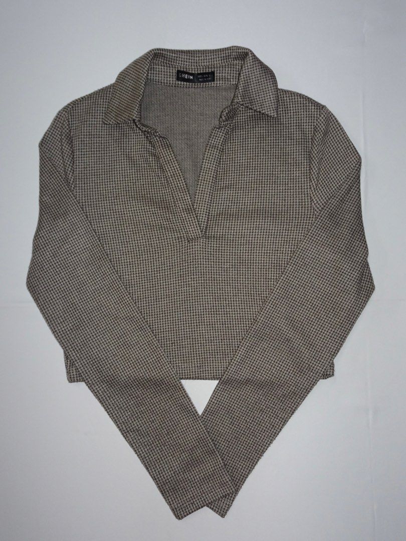 SHEIN Houndstooth Print Cropped Collared Shirt (Category: Blouses) located in Manila. Submitted by kim.declutterss (Listing ID 1453954995, Image 1). Description: - Size: Small (fits XS-small) - Classic brown & white houndstooth print - Cropped silhouette - Long sleeves - Collared neckline with V-cut opening - Comfortable fabric - Versatile for casual outings - Pairs well with high-waisted bottoms.