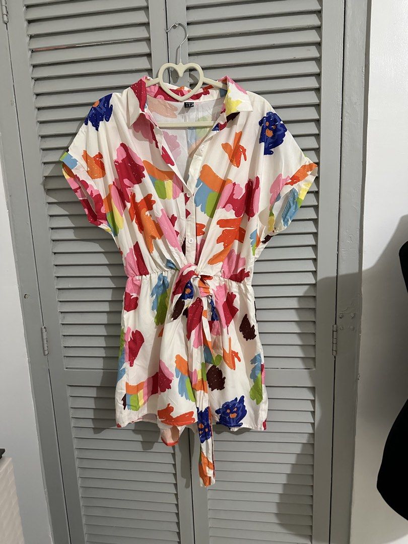 SHEIN White Abstract Print Tie-Waist Romper (Category: Rompers) located in Balanga. Submitted by ruffa_assorted_item (Listing ID 1453819014, Image 1). Description: - Cute white romper with a vibrant, colorful abstract print. - Short sleeves and a classic collared neckline. - Flattering tie-waist detail with an elasticated back for comfort. - Ideal for casual days, beach trips, and easy styling. - Effortlessly chic and comfortable for any occasion
