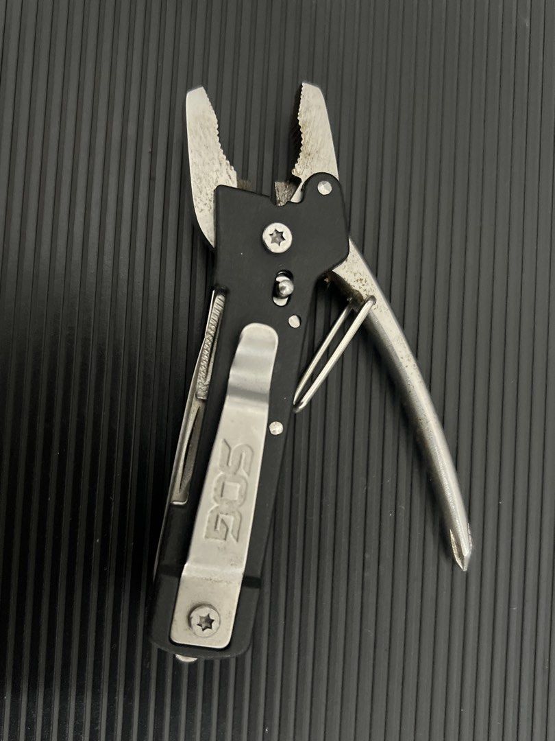 SOG Multi-tool Plier Knife File (Category: Home Improvement Tools & Accessories) located in Cebu City. Submitted by zershrovv (Listing ID 1453909849, Image 2). Description: - SOG Multi-tool - Includes: Pliers, Knife, File - Features: Attached Pocket Clip - Benefits: Compact, Handy for Everyday Carry (EDC), Great for Quick Fixes & Small Tasks - Condition: Shows some signs of use, but fully functional.