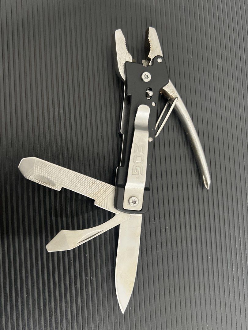 SOG Multi-tool Plier Knife File (Category: Home Improvement Tools & Accessories) located in Cebu City. Submitted by zershrovv (Listing ID 1453909849, Image 1). Description: - SOG Multi-tool - Includes: Pliers, Knife, File - Features: Attached Pocket Clip - Benefits: Compact, Handy for Everyday Carry (EDC), Great for Quick Fixes & Small Tasks - Condition: Shows some signs of use, but fully functional.