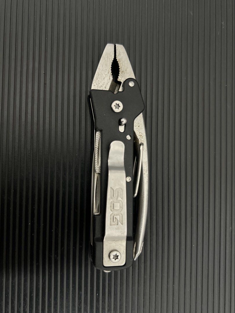 SOG Multi-tool Plier Knife File (Category: Home Improvement Tools & Accessories) located in Cebu City. Submitted by zershrovv (Listing ID 1453909849, Image 3). Description: - SOG Multi-tool - Includes: Pliers, Knife, File - Features: Attached Pocket Clip - Benefits: Compact, Handy for Everyday Carry (EDC), Great for Quick Fixes & Small Tasks - Condition: Shows some signs of use, but fully functional.