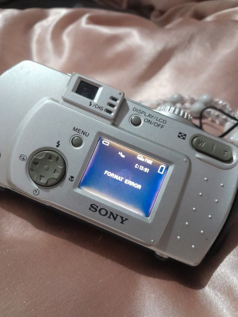 Sony Cybershot (Category: Cameras) located in Lapu Lapu. Submitted by imsyaltsellsart (Listing ID 1453997328, Image 2). Description: Issue: Format error Inclusion: 4 pcs rechargeable Double AA Battery Charger Bag 64 MB memory stick Wrist trap.