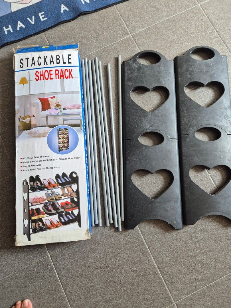 Stackable shoe rack (Category: Outdoor Furniture) located in Singapore. Submitted by mg_sell_buy (Listing ID 1453827965, Image 1). Description: -can hold upto 12 pairs in 4 shelves - sturdy and can be placed outside to manage daily wear shoes and slippers.