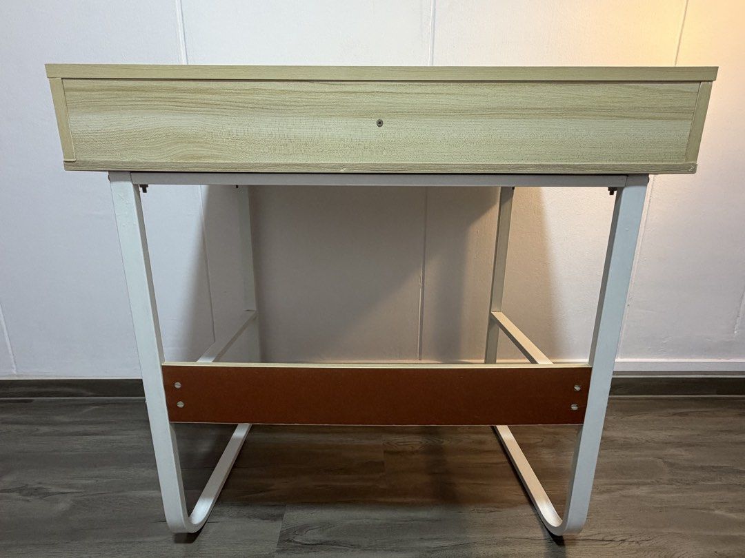 Study table (Category: Tables & Sets) located in Singapore. Submitted by snoopsi_123 (Listing ID 1453901769, Image 3). Description: Shelf and its backboard at the bottom of the table is slightly bent. Dimensions as shown in the photo. Pm for more info Self collect at 550258.