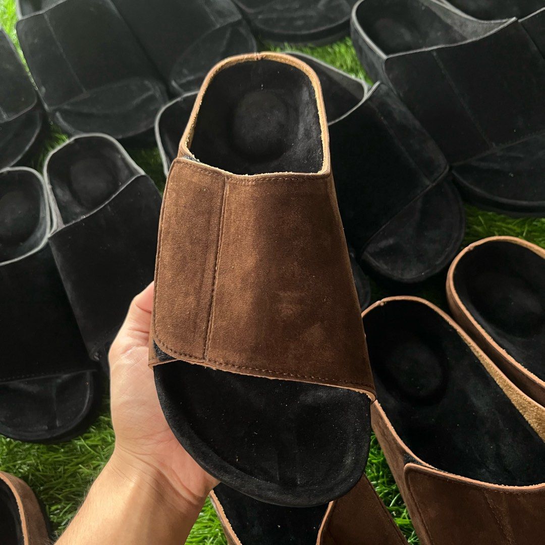 Suede Slides - Black & Brown (Category: Slippers & Slides) located in Antipolo. Submitted by boldfish.2aa198 (Listing ID 1453822279, Image 2). Description: - Synthetic suede material - Available in Black and Brown - Easy slip-on design - Ideal for casual wear - Perfect as a gift for friends or yourself.