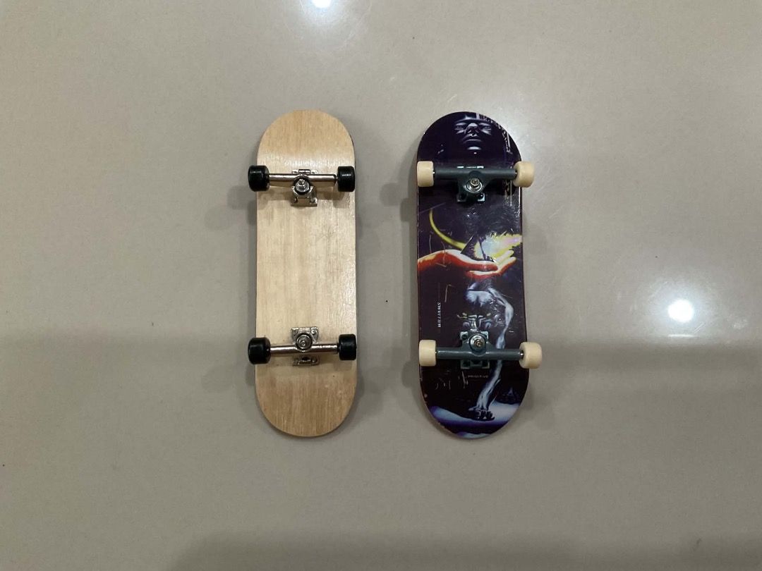 Tech Deck Fingerboards - 2 Pack (Category: Skates, Rollerblades & Scooters) located in Manila. Submitted by rylansstuff (Listing ID 1453876005, Image 2). Description: Two fingerboards for sale, one is official tech deck with sandpaper grip tape, the other is unbranded maple wood with foam grip tape and blank board, good for customizing. If interested in shipping, it will be shouldered by the buyer🙂 (PM if u r interested).