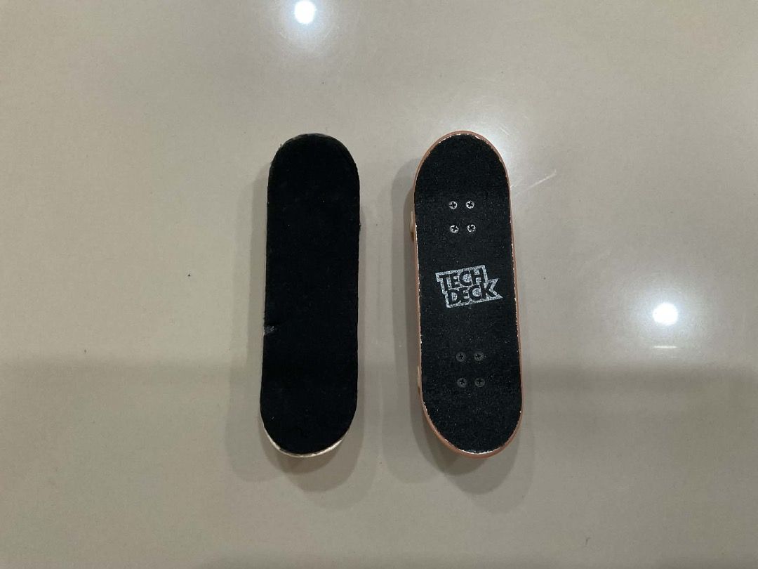 Tech Deck Fingerboards - 2 Pack (Category: Skates, Rollerblades & Scooters) located in Manila. Submitted by rylansstuff (Listing ID 1453876005, Image 1). Description: Two fingerboards for sale, one is official tech deck with sandpaper grip tape, the other is unbranded maple wood with foam grip tape and blank board, good for customizing. If interested in shipping, it will be shouldered by the buyer🙂 (PM if u r interested).