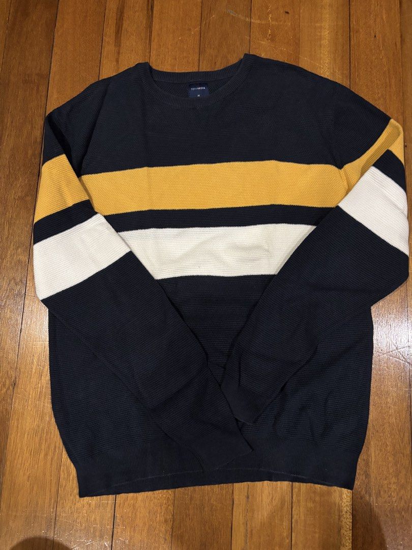 TERRANOVA Navy Blue Striped Sweater Size M (Category: Hoodies) located in Quezon City. Submitted by aaron.declutters (Listing ID 1453982554, Image 1). Description: - Navy blue knit sweater from Terranova - Features horizontal stripes in yellow, white, and navy - Crew neck and long sleeves - Textured knit pattern for added detail - Versatile for layering or standalone wear - Comfortable and stylish design.