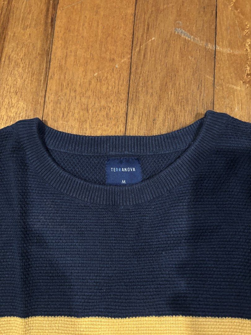 TERRANOVA Navy Blue Striped Sweater Size M (Category: Hoodies) located in Quezon City. Submitted by aaron.declutters (Listing ID 1453982554, Image 2). Description: - Navy blue knit sweater from Terranova - Features horizontal stripes in yellow, white, and navy - Crew neck and long sleeves - Textured knit pattern for added detail - Versatile for layering or standalone wear - Comfortable and stylish design.