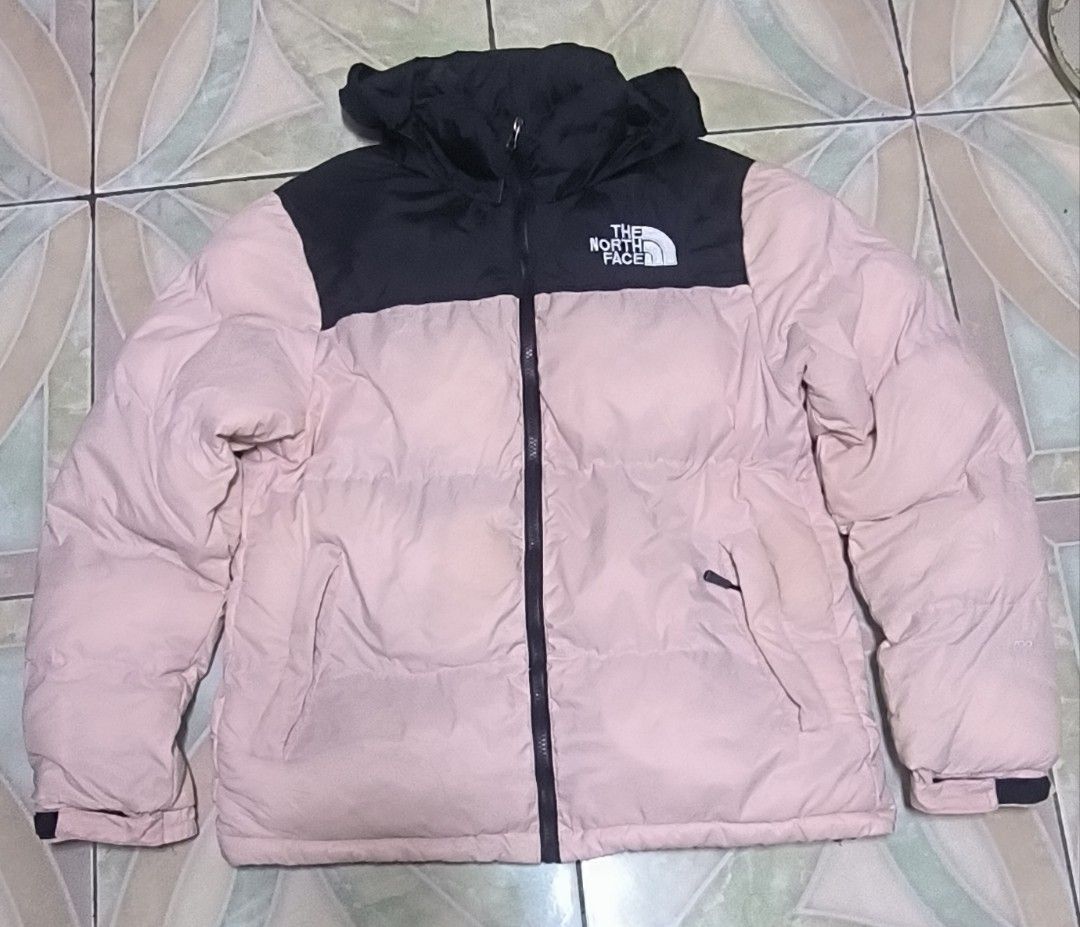 The North Face 700 Puffer Jacket Pink Black (Category: Coats, Jackets and Outerwear) located in Manila. Submitted by itsmelawrence (Listing ID 1453855828, Image 1). Description: - Brand: The North Face 700 series - Style: Puffer Jacket - Size M 22x26 - Color: Pink body with black shoulders and packable hood need wash may dumi bandang harap.