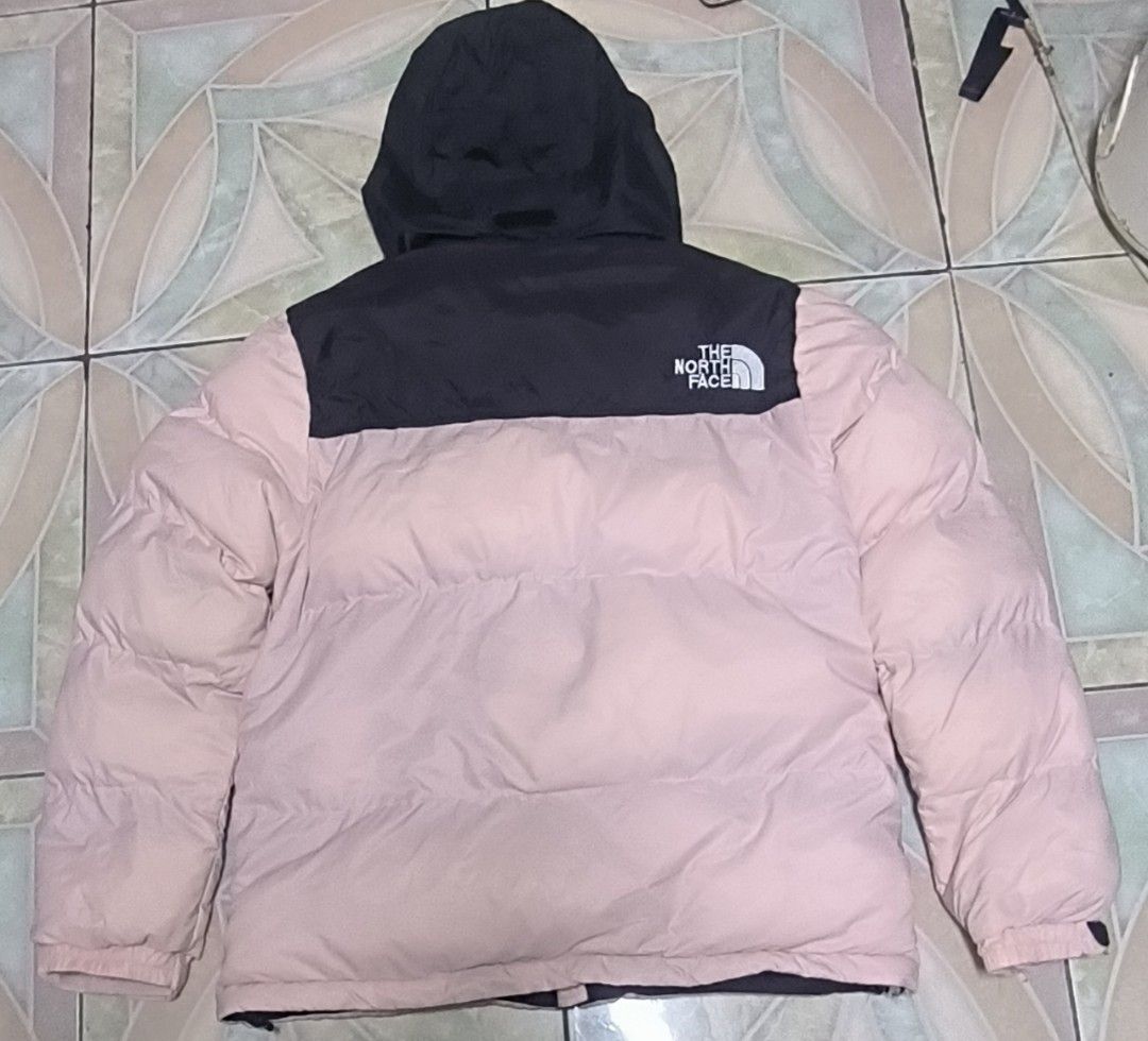 The North Face 700 Puffer Jacket Pink Black (Category: Coats, Jackets and Outerwear) located in Manila. Submitted by itsmelawrence (Listing ID 1453855828, Image 2). Description: - Brand: The North Face 700 series - Style: Puffer Jacket - Size M 22x26 - Color: Pink body with black shoulders and packable hood need wash may dumi bandang harap.