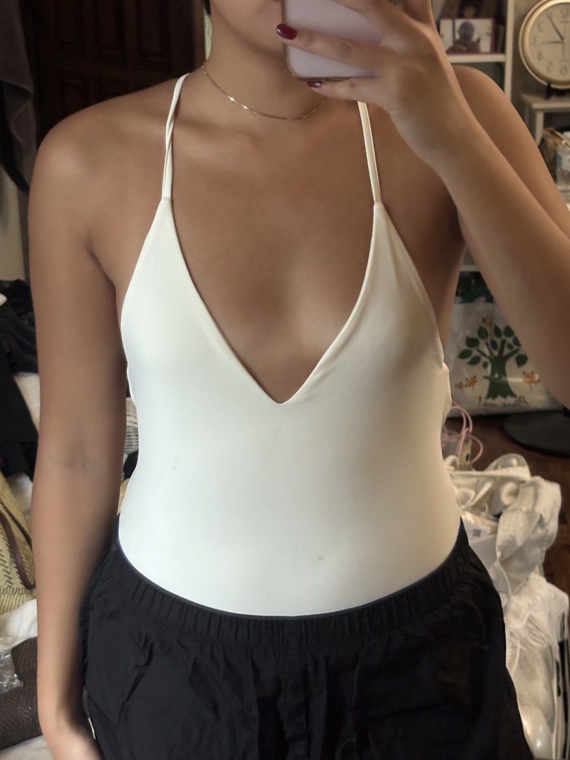 Tiger Mist White V-Neck Halter Backless Bodysuit XS (Category: Others Tops) located in Quezon City. Submitted by prebym (Listing ID 1453877963, Image 2). Description: - White Tiger Mist bodysuit - Size: XS - V-neck with halter straps - Backless design - No opening for the cr0tch. it’s designed like a swimsuit - Small mark on front (refer to last photo). can probably be washed off - Versatile: great for layering or wearing alone my measurements: 3