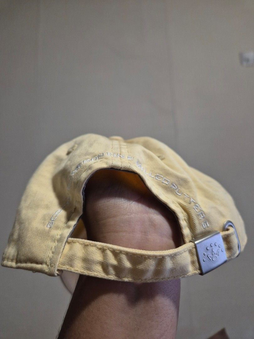 Titleist Golf Cap Yellow Adjustable Strap (Category: Caps & Hats) located in Manila. Submitted by rpaul88 (Listing ID 1453987565, Image 3). Description: - Yellow Titleist golf cap - Adjustable strap for a comfortable fit - Embroidered Titleist logo on the side - Crown-like design embroidered on the front - 'MILLER PUTTER 5' embroidered on the brim - Ideal for sunny days on the golf course or casual outings.