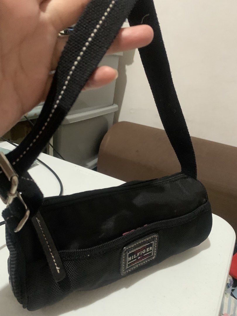 Tommy Hilfiger Black Nylon Shoulder Bag (Category: Shoulder Bags) located in Rizal. Submitted by jekomy (Listing ID 1453897078, Image 2). Description: - Black Tommy Hilfiger shoulder bag - Durable nylon material - Iconic Tommy Hilfiger logo patch on the front - Adjustable strap for customized comfort - Spacious interior, ideal for essentials - Versatile for everyday errands or travel adventures.