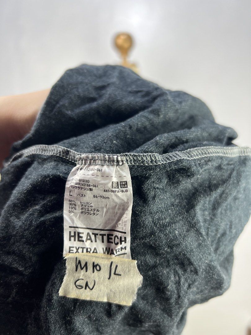 Uniqlo Heattech Extra Warm Turtleneck Top (L) (Category: Longsleeves) located in Baguio. Submitted by trenchcoats.ph (Listing ID 1453819847, Image 2). Description: - Uniqlo Heattech Extra Warm Turtleneck Top - Color: Grey - Size: L - Style: Long sleeves - Material: Acrylic, Polyester, Polyurethane - Features: Extra warm, comfortable, ideal for layering in cold weather.