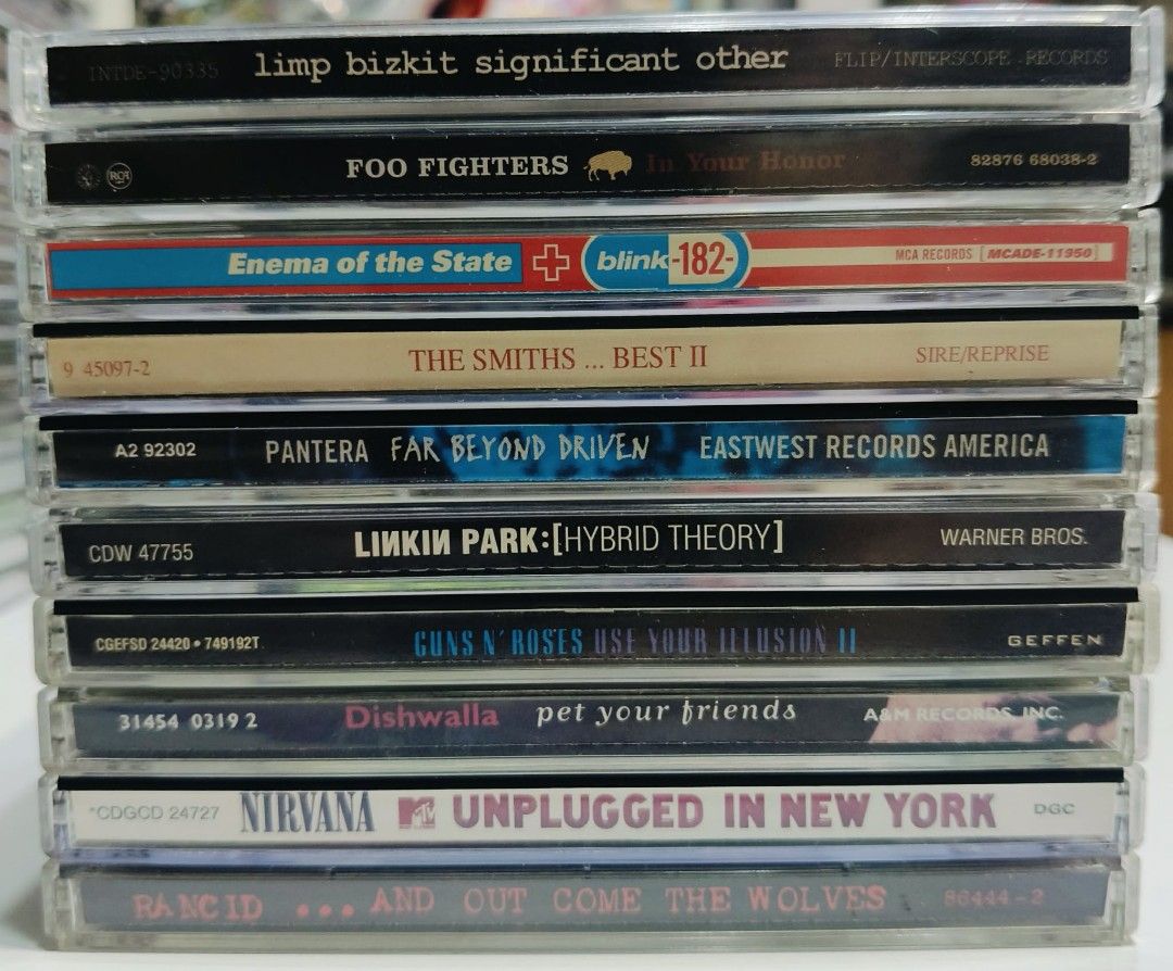Various Rock CDs batch 1 (Category: CDs & DVDs) located in Taguig. Submitted by sellout2ny (Listing ID 1453847918, Image 1). Description: 350 each Nearmint conditions ❗️SOLD Blink 182 Rancid Nirvana Dishwalla Limp Bizkit The Smiths Foo Fighters GnR - Collection of classic rock and alternative CDs. - Featuring iconic albums like Linkin Park's Hybrid Theory, Pantera's Far Beyond Driven, and Nirvana's Unplugged in New York. - Also includes CDs from 