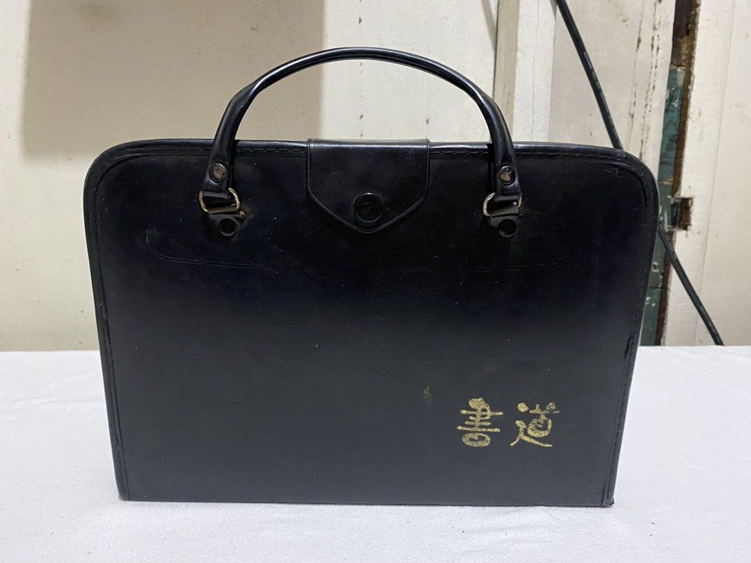 Vintage Chinese Calligraphy Set with Book and Case (Category: Stationery & School Supplies) located in Manila. Submitted by resi.diaz (Listing ID 1453839629, Image 1). Description: - Complete Chinese calligraphy set - Stylish black case with gold Chinese characters - Includes '中学新书写' calligraphy book - Comes with ink stone, brushes, and ink sticks - Perfect for beginners learning Chinese calligraphy - Case features a handle for easy portability.