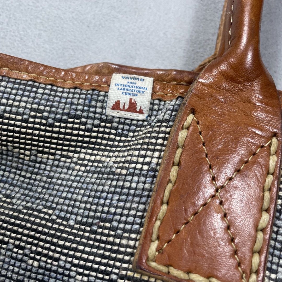 VISVIM HOMER TOTE BAG COWHIDE LEATHER STRAP (Category: Belt bags, Clutches and Pouches) located in Manila. Submitted by revise.ph_ (Listing ID 1454001456, Image 2). Description: VISVIM HOMER TOTE BAG COWHIDE LEATHER STRAP Made in CHINA Length:16 Width:25.5 Side width:7.5 Strap:9 Issue:Not sure if design or issue check the detailed photo Price:20,000 Free Shipping Via jnt.