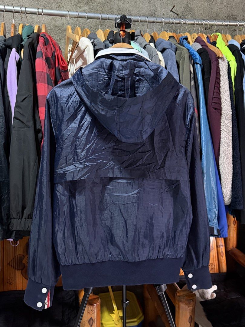 W Jacket Navy Blue Hooded Windbreaker Size 4 (Category: Coats, Jackets and Outerwear) located in Bulacan. Submitted by eman02 (Listing ID 1453890548, Image 2). Description: - Navy blue hooded windbreaker jacket - Full zip front with white accents - Two zip pockets - Ribbed cuffs and hem - Lightweight and ideal for layering - Suitable for casual wear or outdoor activities.