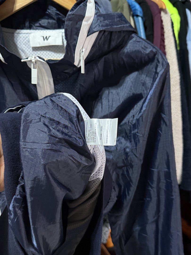 W Jacket Navy Blue Hooded Windbreaker Size 4 (Category: Coats, Jackets and Outerwear) located in Bulacan. Submitted by eman02 (Listing ID 1453890548, Image 3). Description: - Navy blue hooded windbreaker jacket - Full zip front with white accents - Two zip pockets - Ribbed cuffs and hem - Lightweight and ideal for layering - Suitable for casual wear or outdoor activities.