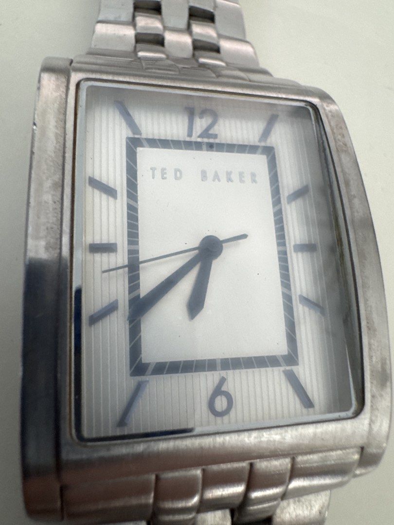 Watch (Category: Men's Watches) located in Singapore. Submitted by ndabsolute (Listing ID 1453862525, Image 3). Description: - Brand: Ted Baker - Style: Rectangular designer watch - Material: Stainless steel case and bracelet - price does not include batteries.