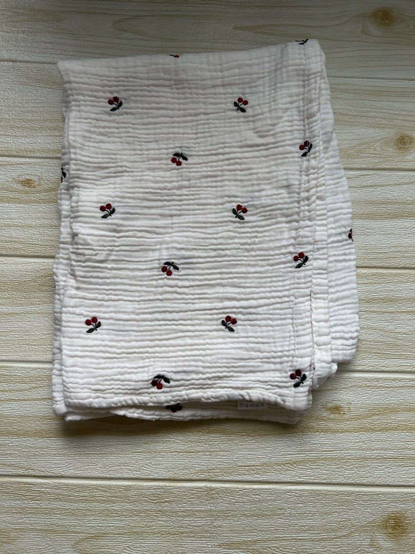white muslin swaddle blanket (Category: Baby Toiletries & Grooming) located in Cebu City. Submitted by yjainani (Listing ID 1453988849, Image 2). Description: featuring a red cherry embroidered pattern. suitable for nursing cover.
