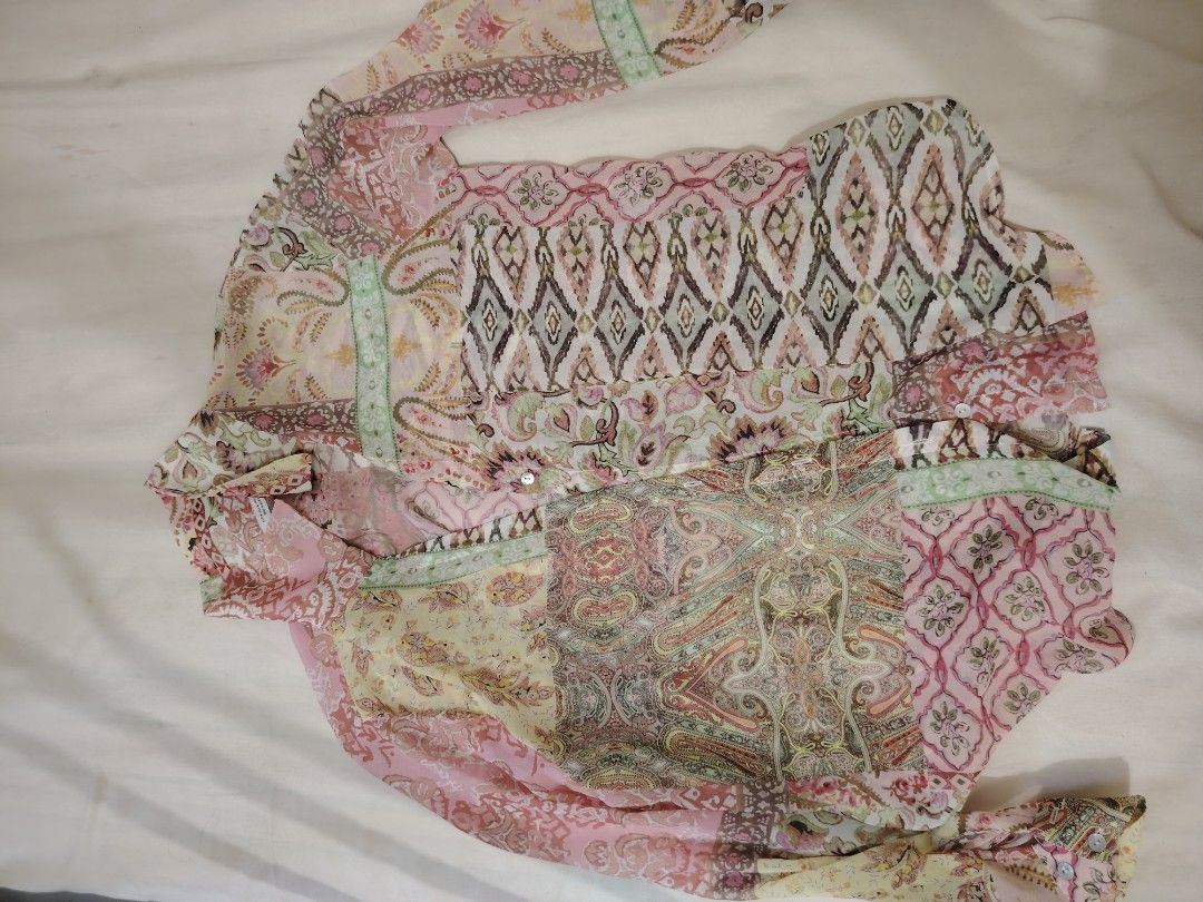 Zara Patchwork Print Long Sleeve Shirt (Category: Tshirts & Polo Shirts ) located in Cordova. Submitted by prelovedceb7 (Listing ID 1453845863, Image 2). Description: - Zara patchwork print shirt - Size: Medium (M) - Long sleeves with button cuffs - Button-up front closure - Lightweight material, ideal for layering - Unique pattern with pink, green, and beige tones - Made in Morocco.